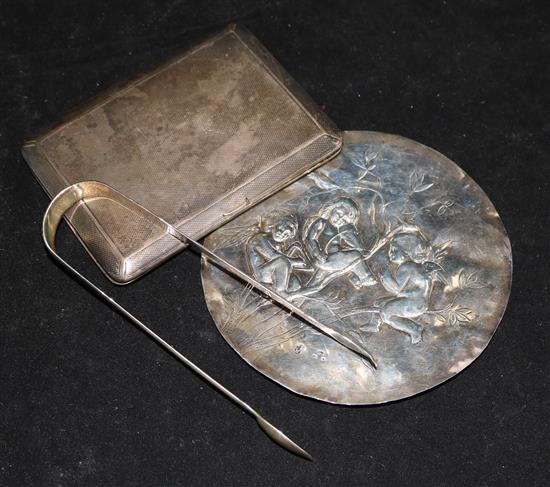 A late Victorian repousse silver plaque by Charles Stuart Harris, a silver cigarette case and a pair of Georgian sugar tongs.